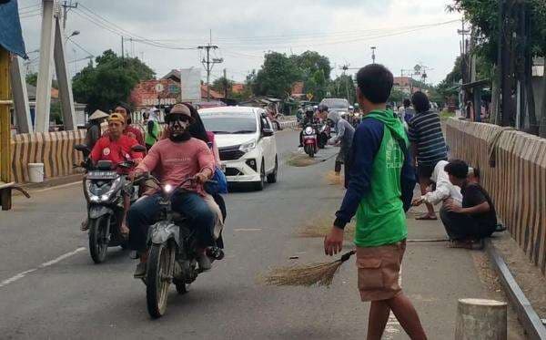 Tradisi Sapu Koin di Jembatan Sewo, Antara Berkah dan Bahaya Tradisi Sapu Koin di Jembatan Sewo, Antara Berkah dan Bahaya